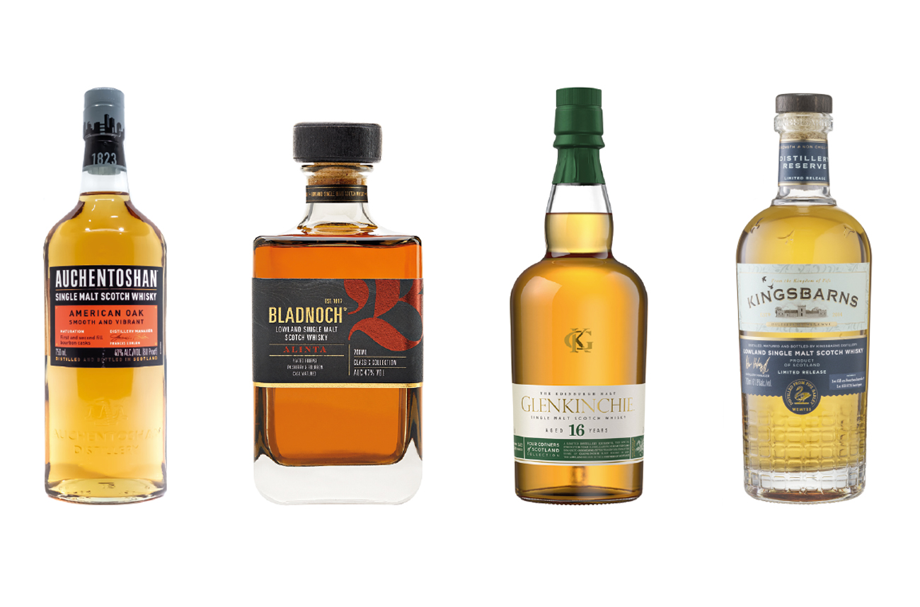 Four bottles of whisky against a white background