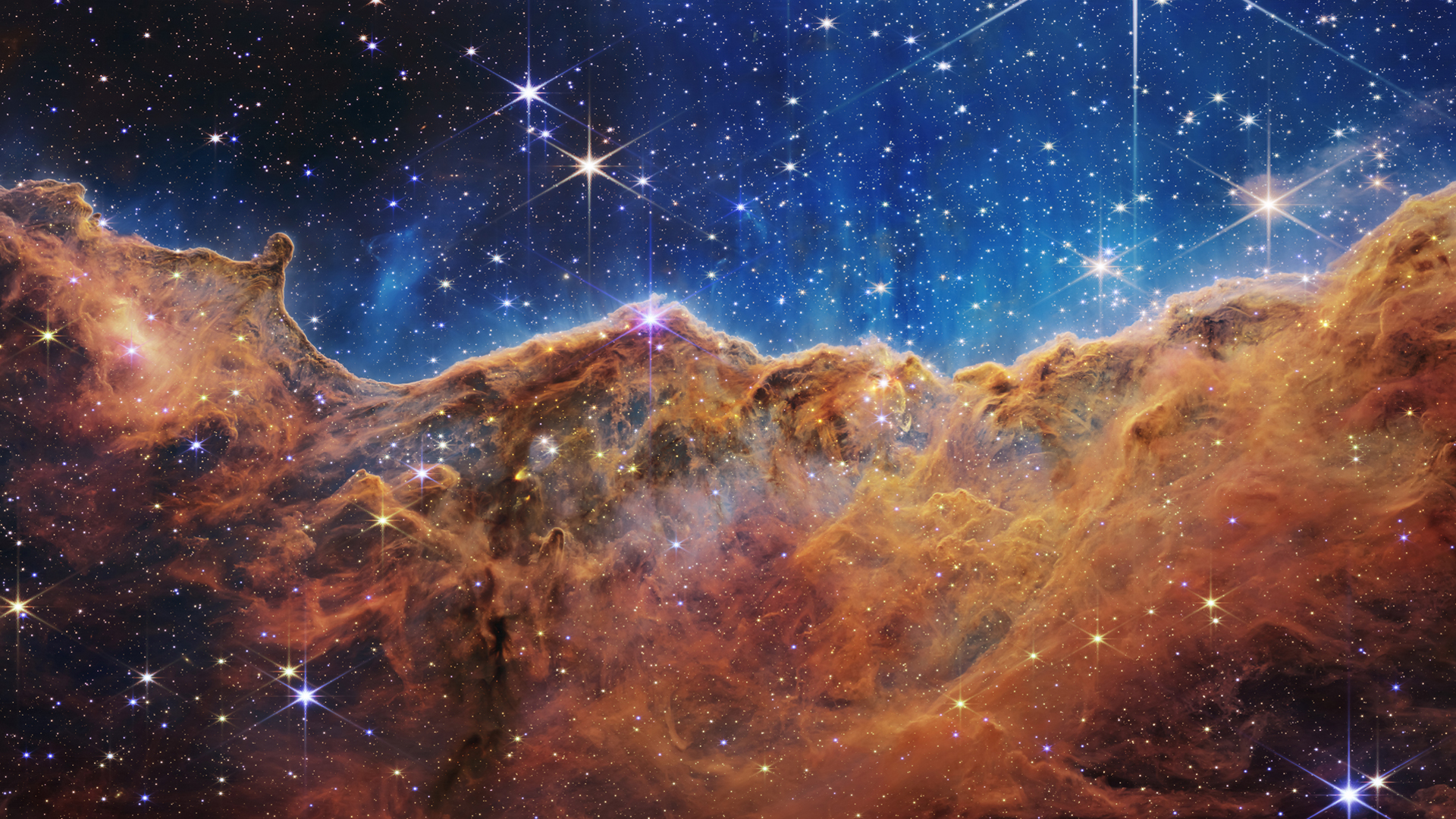 The Cosmic Cliffs in Carina Nebula captured by the James Webb Space Telescope.