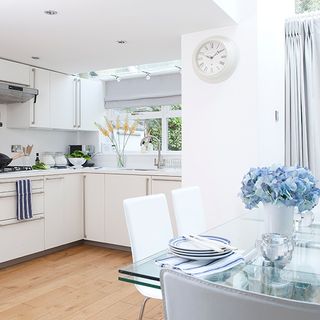 kitchen with wooden flooring and white wall