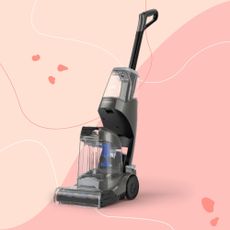 VAX ONEPWR Cordless Compact Carpet Cleaner on a pink background