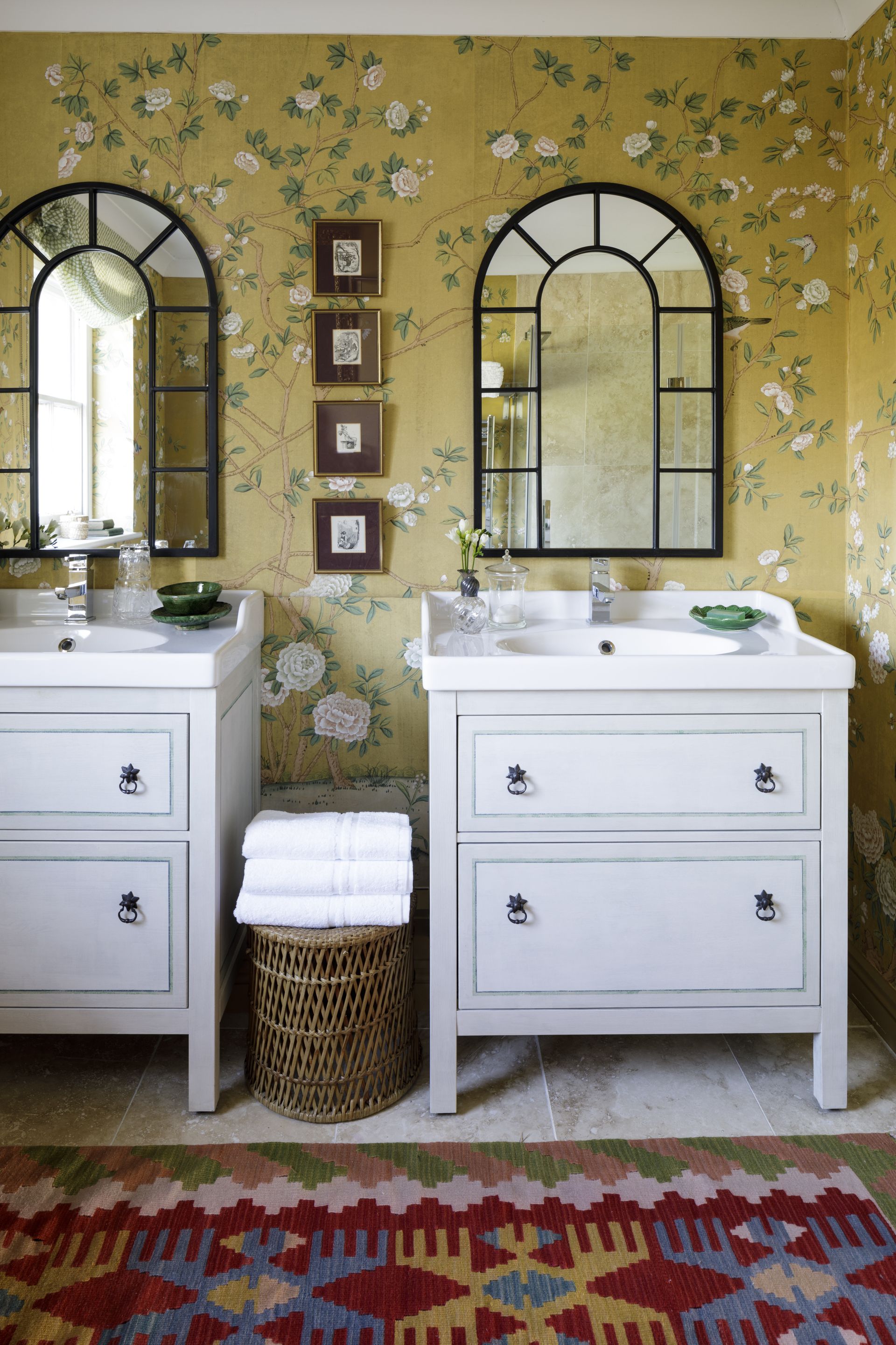 Yellow wallpaper with white flowers and green leaves