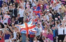 Crowd cheering with union jack flags