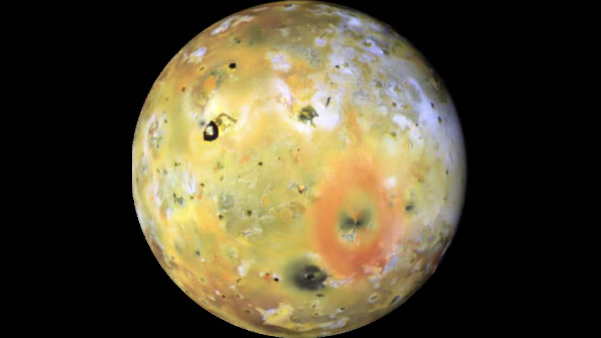 An image of Io. It is yellow, with splotches of orange and blue.