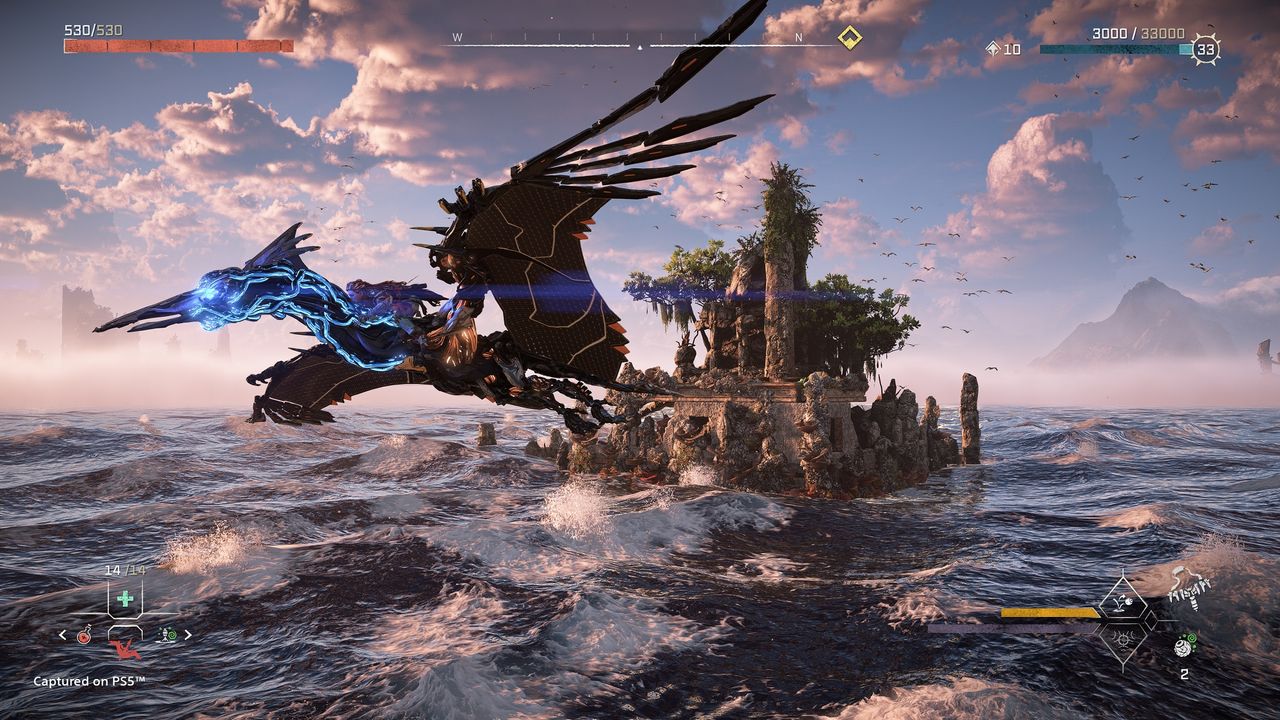 Aloy rides a sunwing over the ocean in Horizon Forbidden West