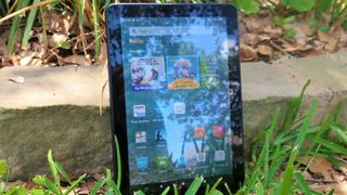 Amazon Fire HD 8 (2020) tablet standing upright on a field of grass