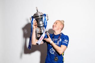 Bethany England of Chelsea poses for a photo with the Vitality Women's FA Cup Trophy after their sides victory during the Vitality Women's FA Cup Final match between Arsenal and Chelsea at Wembley Stadium on December 05, 2021 in London, England.