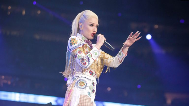 Gwen Stefani wearing GXVE makeup while performing onstage