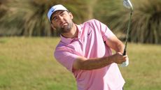 Scottie Scheffler takes a shot during a practice round before the Hero World Challenge