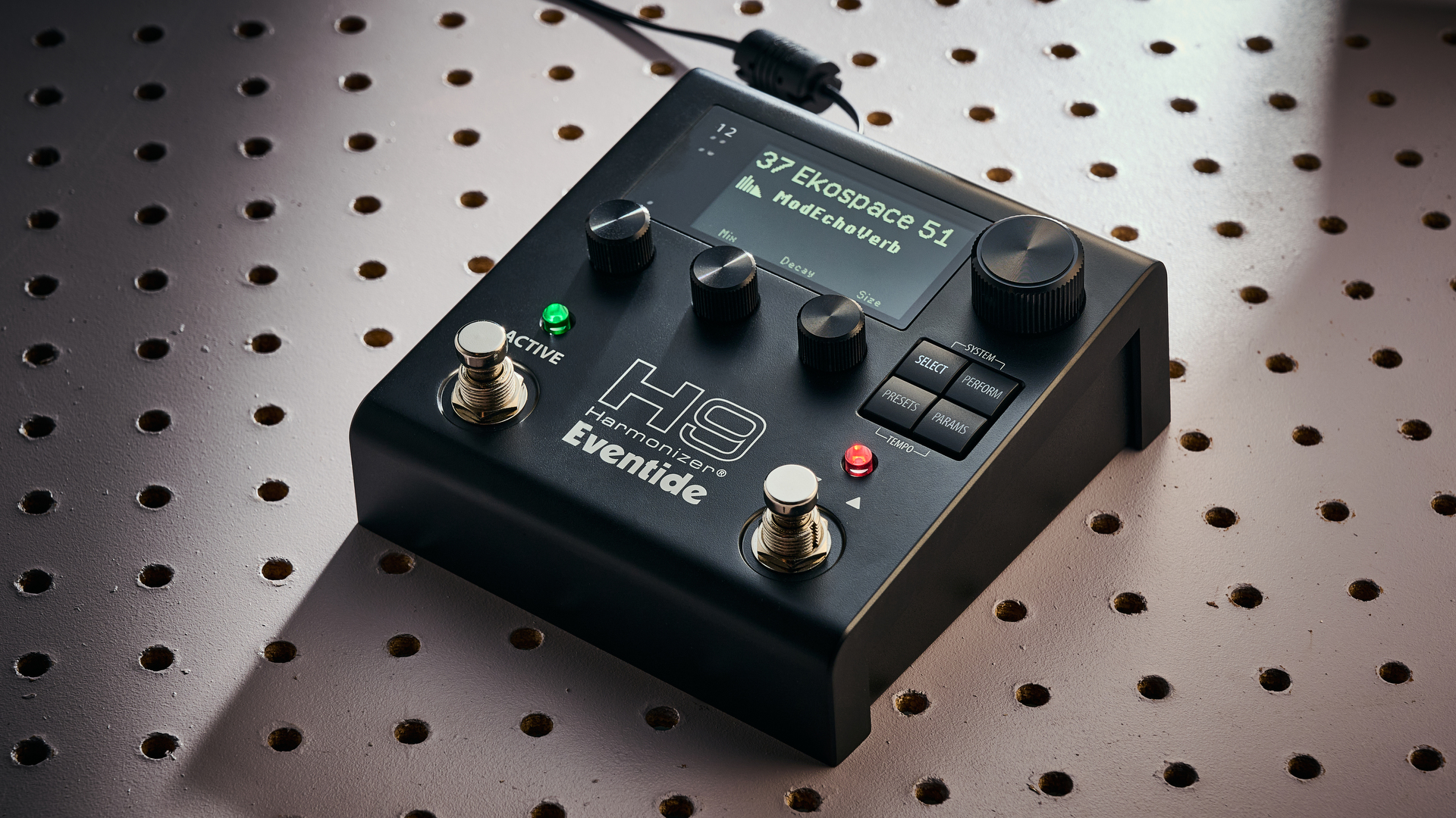 An Eventide H9 Harmonizer Gen 2 multi-effects pedal on a white pegboard