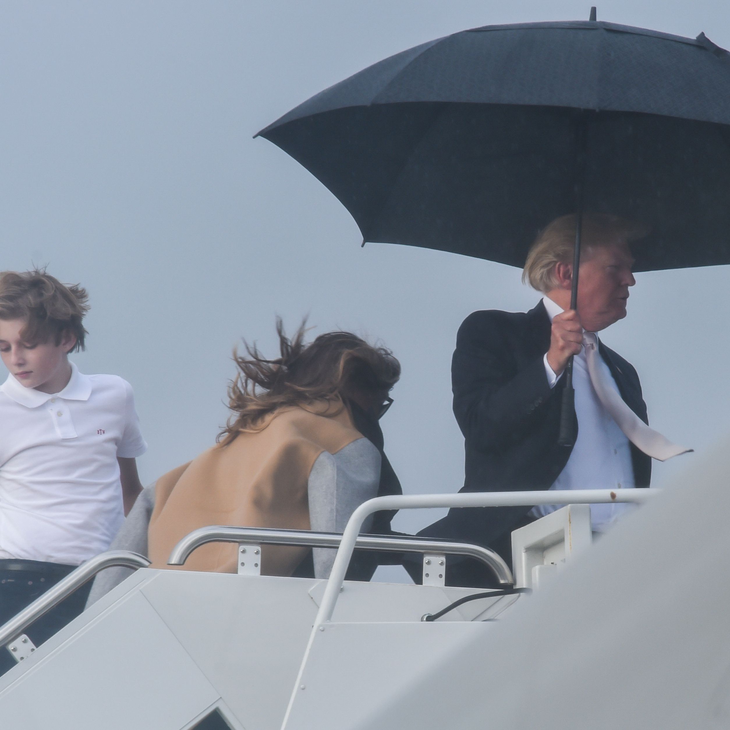 Donald Trump Won T Share Umbrella With Melania And Barron Marie Claire