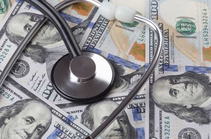 dollar banknotes with stethoscope