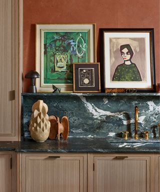 Kitchen with artwork displayed on a wall shelf