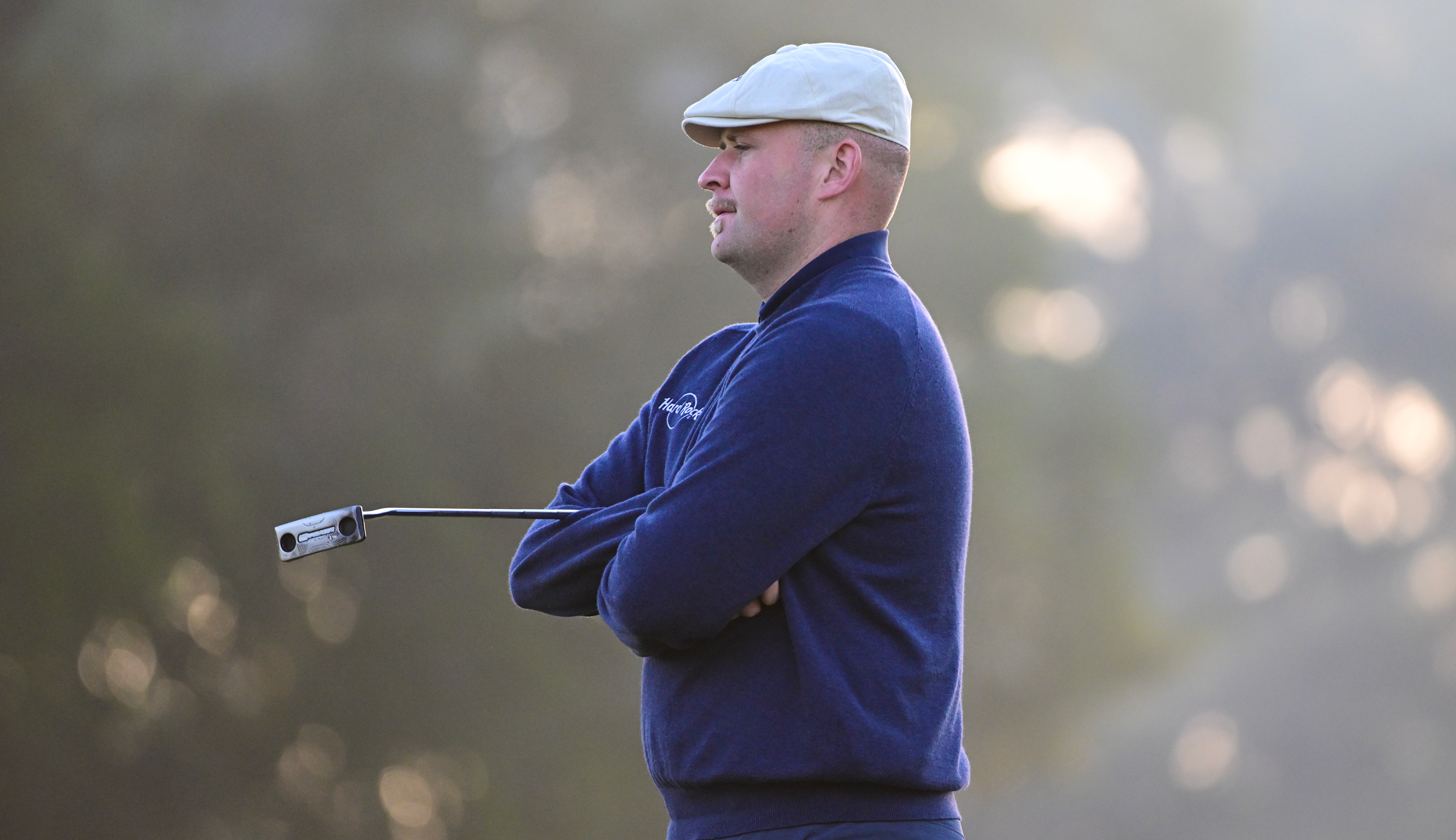 Harry Hall waits on the green to putt