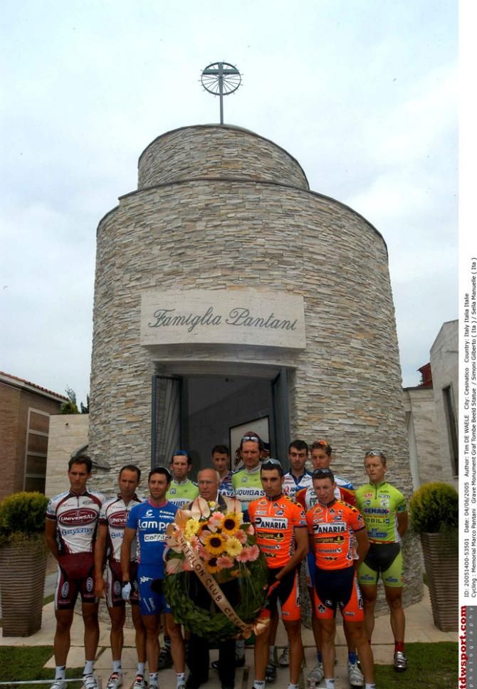 Professional cyclists pay their respects at the grave of Marco Pantani