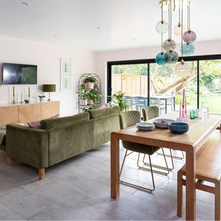 open plan living room and diner with sofa and table and chairs