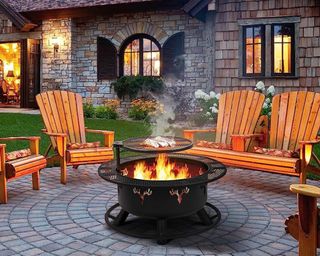 Best fire pits lifestyle image of fire pit lit in garden