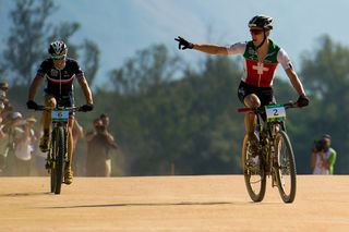 Nino Schurter of Switzerland celebrates his win ahead Maxime Marotte of France