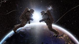 Two astronauts in full spacesuits with backpacks on a space walk with tethers, facing each other with hands out. They are floating in the front of Planet Earth as the sun rises between them.