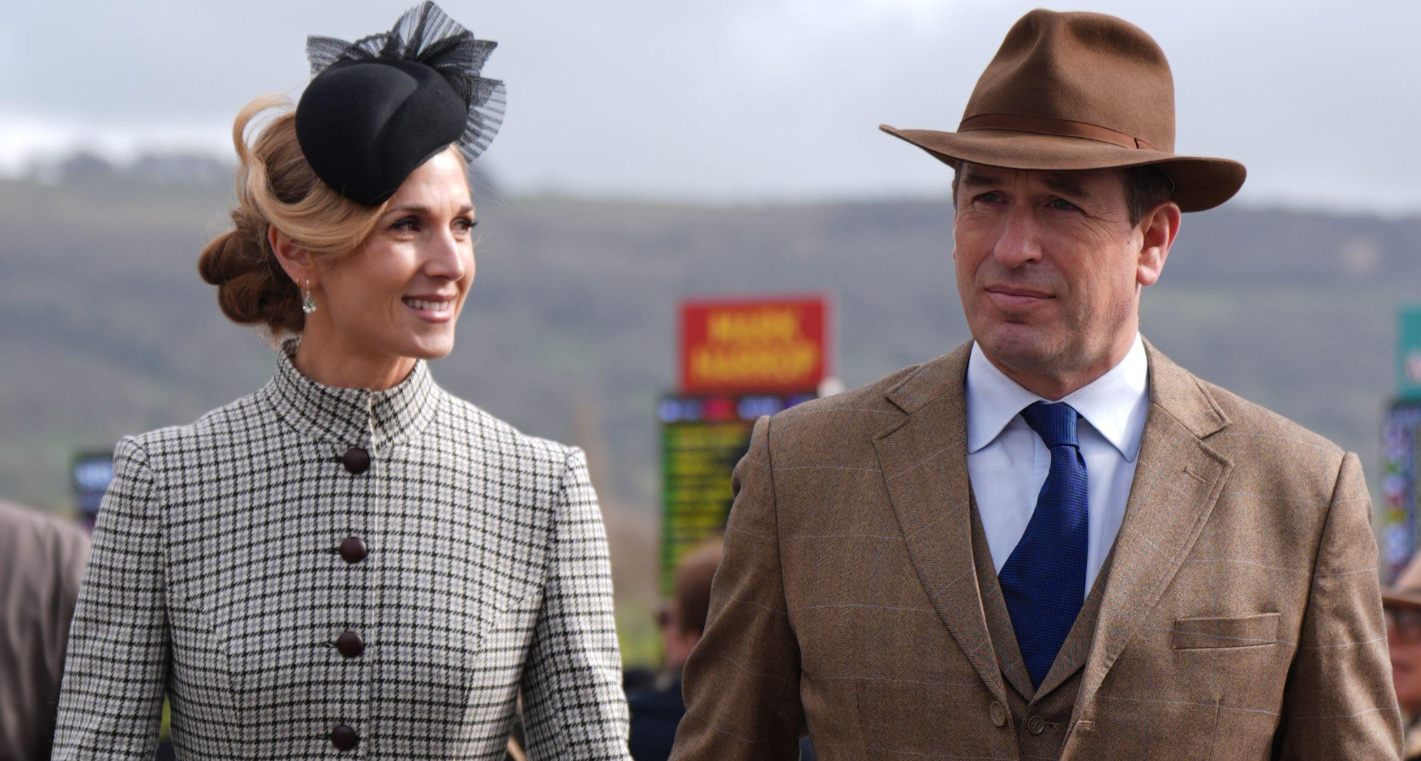 Harriet Sperling and Peter Phillips holding hands at Cheltenham Festival