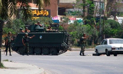 Lebanese soldiers man a checkpoint in the northern city of Tripoli 
