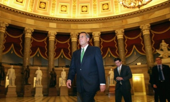 House Speaker John Boehner walks to the House Chamber to oversee the New Year&amp;#039;s Day fiscal-cliff vote.