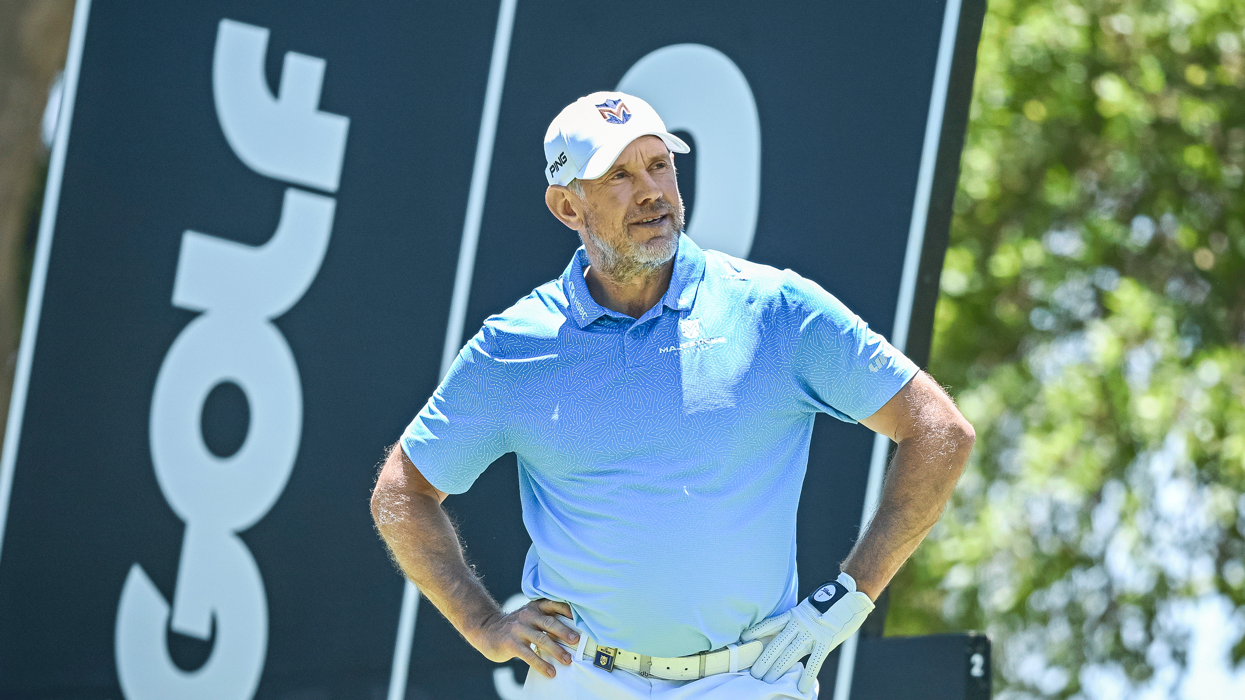 Lee Westwood stands with his hands on his hips during a LIV Golf event in 2026