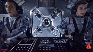 Astronauts work in their spacecraft cockpit in this still from the 2013 science fiction film ‘Europa Report.’