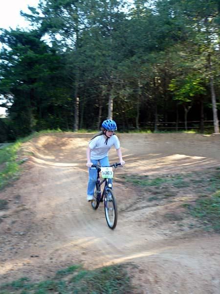 A girl plays on the pump track.