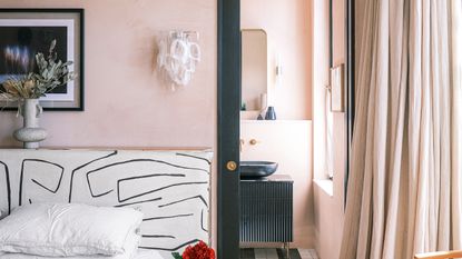 Pink bedroom with plaster effect walls