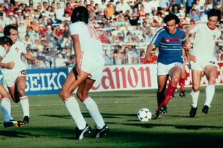 Michel Platini on the ball for France against Portugal at Euro 84