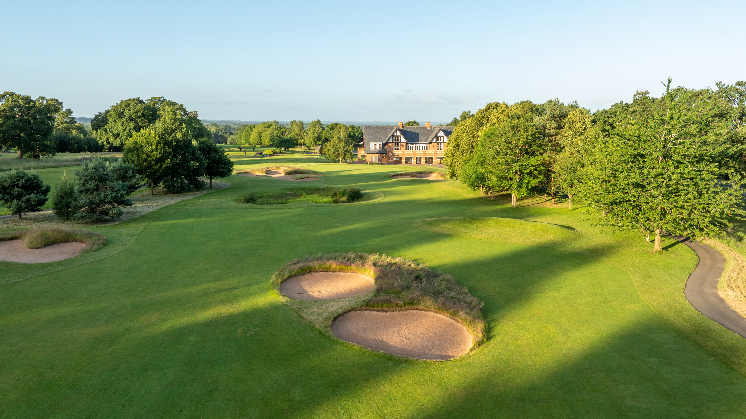 An aerial view looking down the 18th hole at Carden Park's Cheshire Course