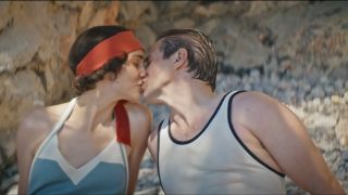 Tuppence Middleton and Allen Leech kiss in bathing suits on the beach in Downton Abbey: A New Era.