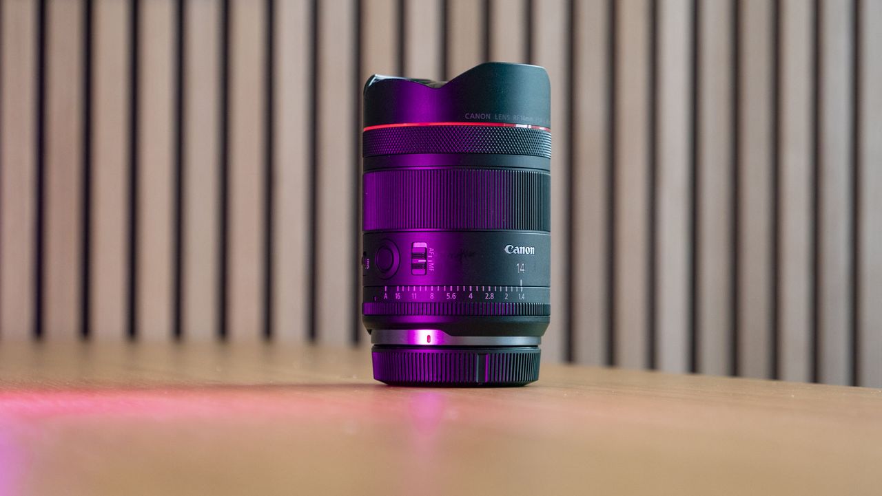 Canon RF 14mm F1.4L VCM lens on a wooden surface