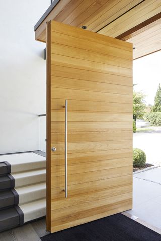 Timber pivot front door with shot of inside hallway