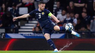 Scotland's Andy Robertson volleying the ball in a June 2023 match against Georgia.