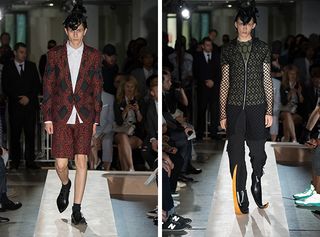 Males models walking the runway wearing red and black suits from the Comme des Garcons Homme SS2015 Collection