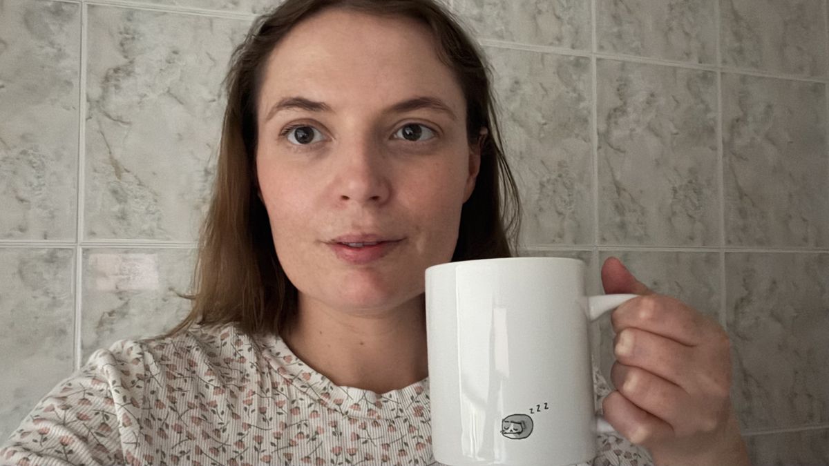 Sleep writer Ruth Jones holds up a mug
