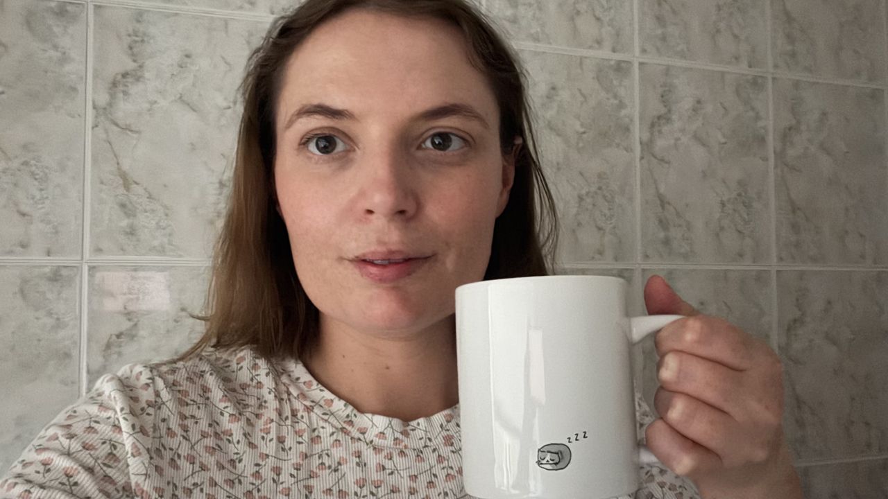 Sleep writer Ruth Jones holds up a mug