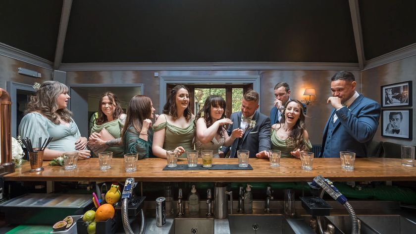 Photograph of wedding guests enjoying themselves in a wedding venue, captured from behind the bar by photographer and educator Nick Church, who will be speaking at The Photography &amp; Video Show 2026