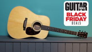 A Martin D-28 sits atop a bench, with a blue-colored wall behind it