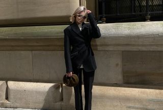 Woman wearing a black suit.