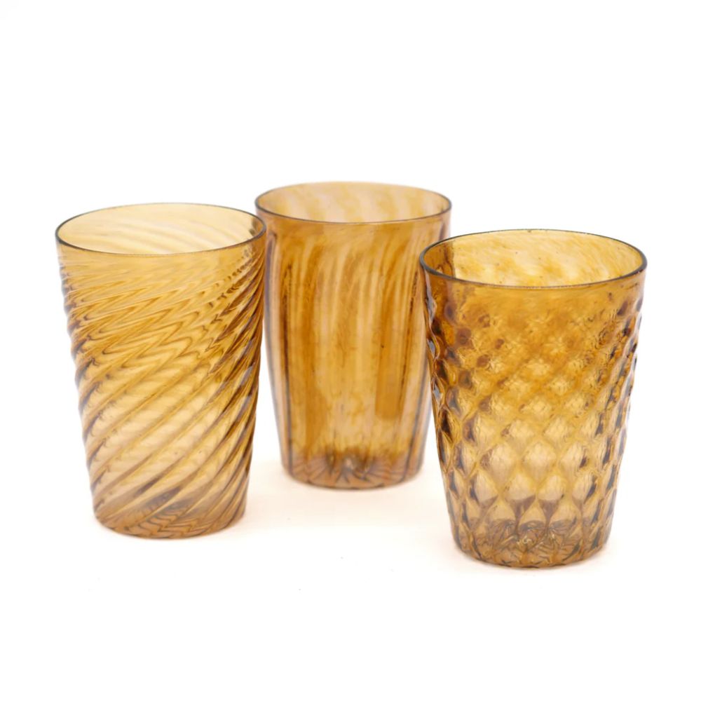 Set of three amber glass textured tumblers