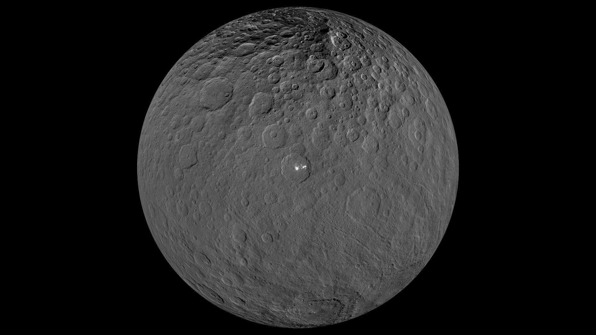 An orthographic projection from NASA's Dawn spacecraft showing the dwarf planet Ceres.  It focuses on the brightest area on Ceres, the Occator Crater.