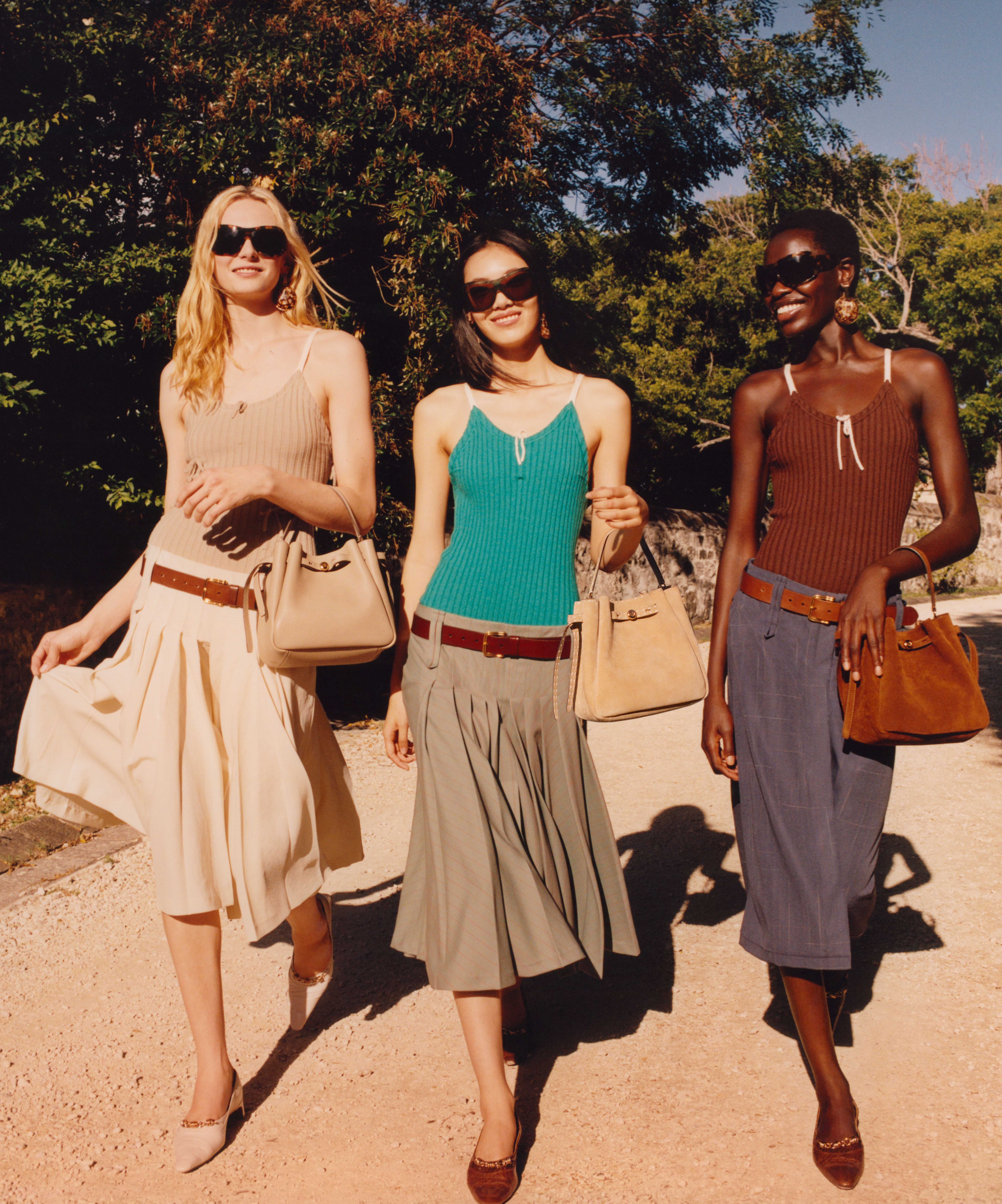 Models wearing low-rise skirts in the Tory Burch SS26 campaign
