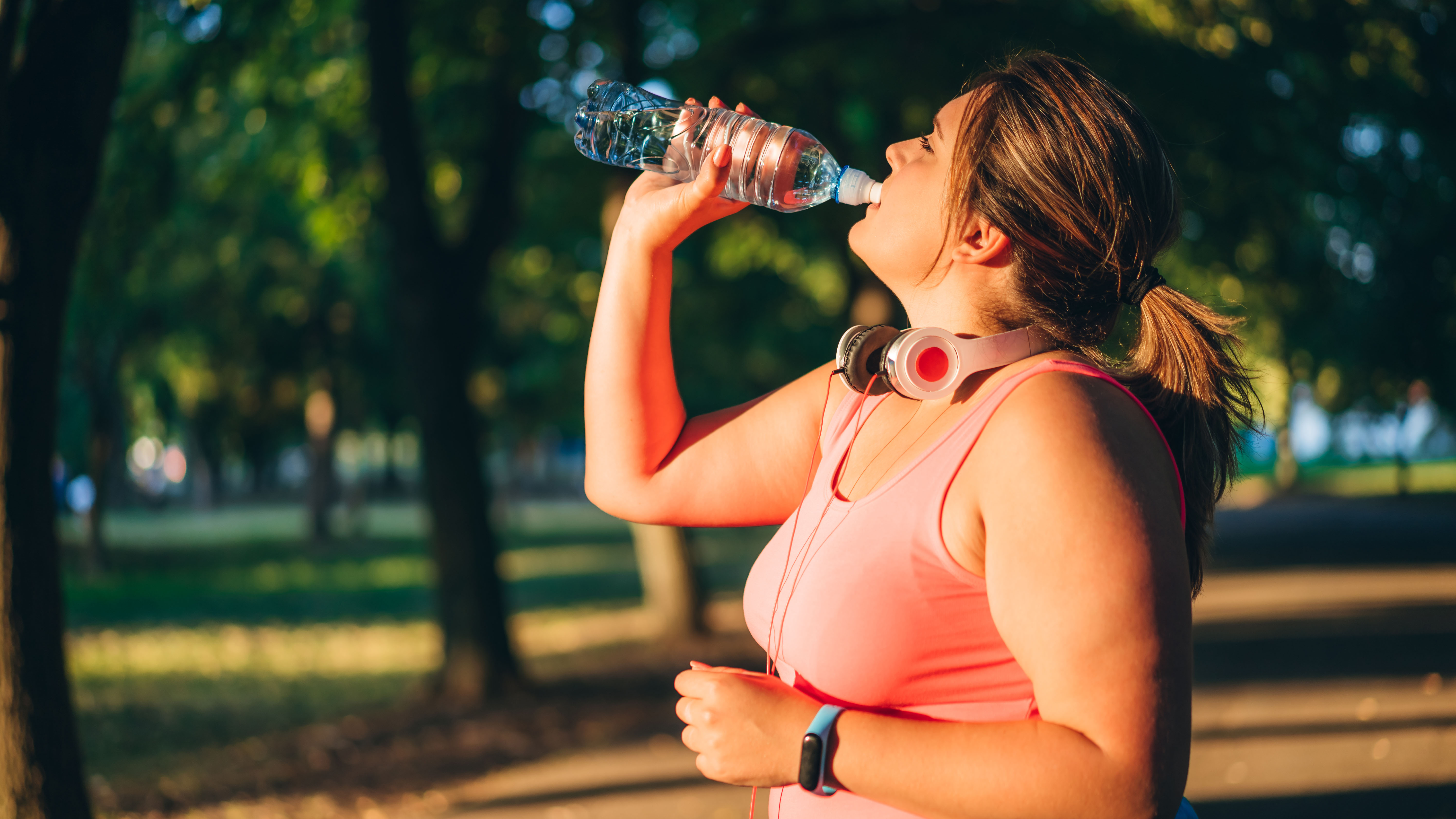 Woman drinking water during workout
