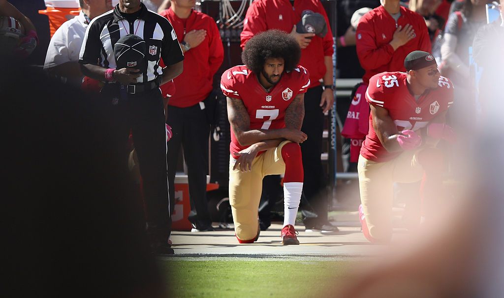 Colin Kaepernick kneels