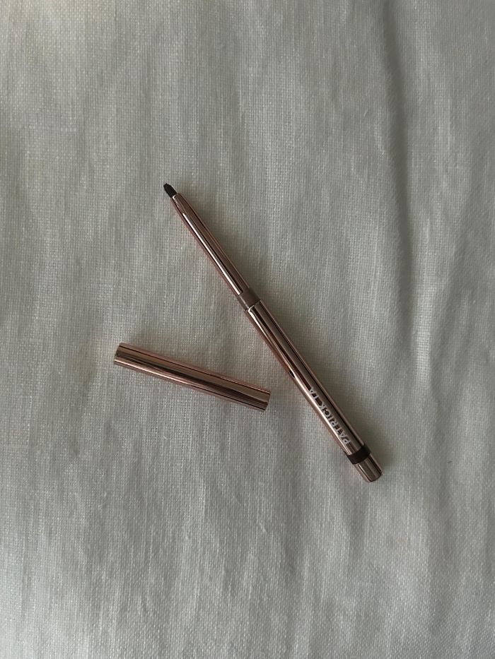 PATRICK TA Major Dimension Precision Gel Liner on a white linen background