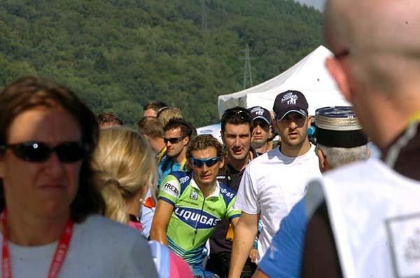 The stage winner weaves his way through the crowds on his way to the podium
