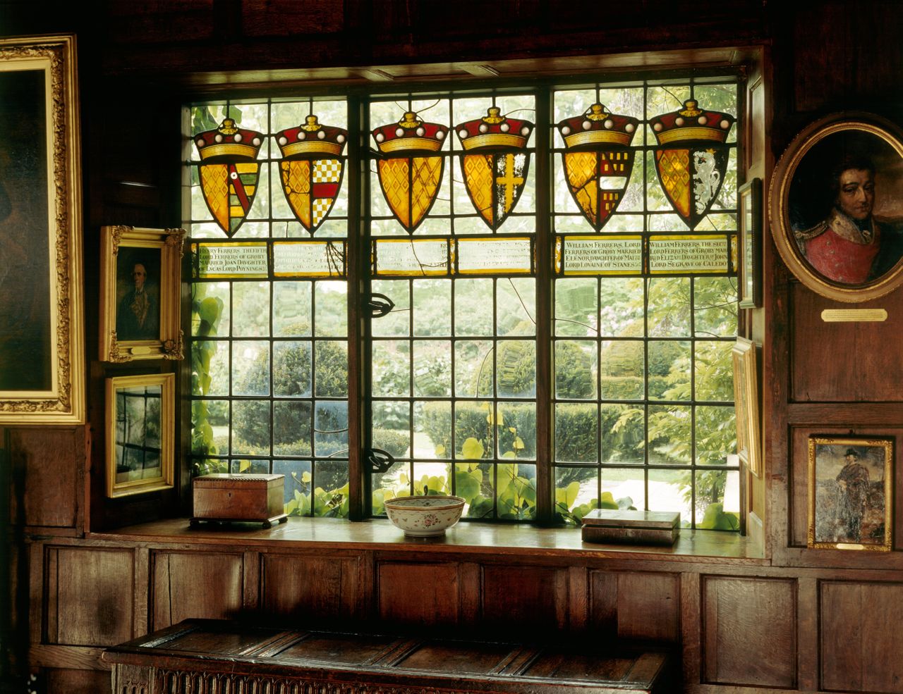Detail of the heraldic glass in the Great Hall. The glass celebrates the antiquity and history of the Ferrers family through family standards.