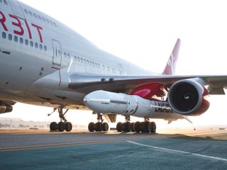 Virgin Orbit's LauncherOne rocket was mated to its carrier aircraft, a modified 747 known as Cosmic Girl, for the first time on Oct. 24, 2018, at Long Beach Airport.